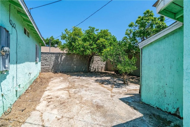 11860 Athens Way, Los Angeles, CA 90061 - fenced backyard featuring a patio area