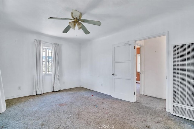 11860 Athens Way, Los Angeles, CA 90061 - carpeted spare room featuring a heating unit and ceiling fan