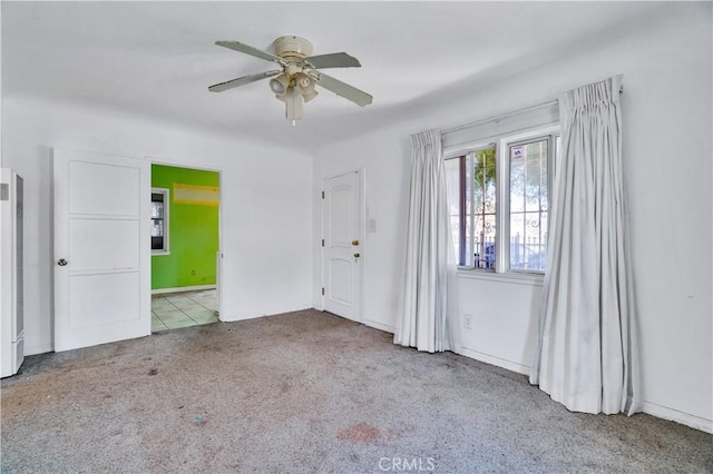 11860 Athens Way, Los Angeles, CA 90061 - unfurnished room with carpet flooring, a ceiling fan, and a heating unit