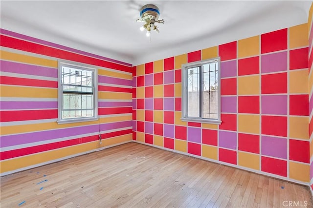 11860 Athens Way, Los Angeles, CA 90061 - spare room with hardwood / wood-style floors, wallpapered walls, and ceiling fan