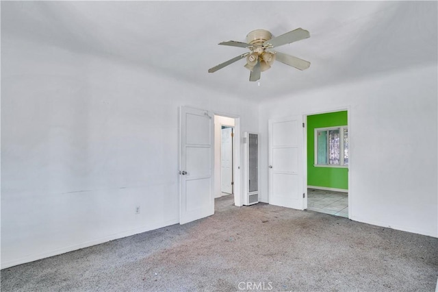 11860 Athens Way, Los Angeles, CA 90061 - unfurnished bedroom with carpet floors, a heating unit, and a ceiling fan