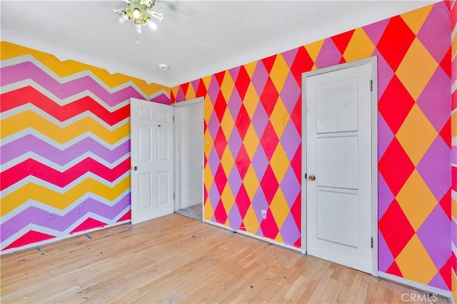 11860 Athens Way, Los Angeles, CA 90061 - recreation room featuring hardwood / wood-style floors and wallpapered walls