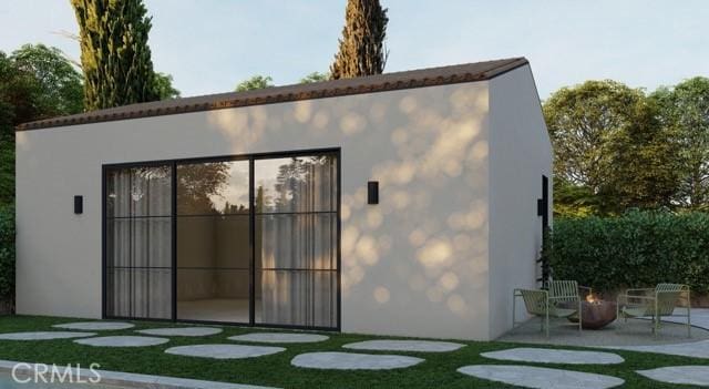 4116 Greenbush Ave, Sherman Oaks, CA 91423 - back of property featuring stucco siding, a fire pit, and a patio area