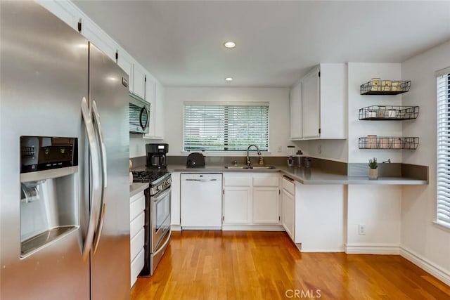 529 El Azul Cir, Oak Park, CA 91377 - kitchen featuring appliances with stainless steel finishes, light wood finished floors, white cabinets, and recessed lighting