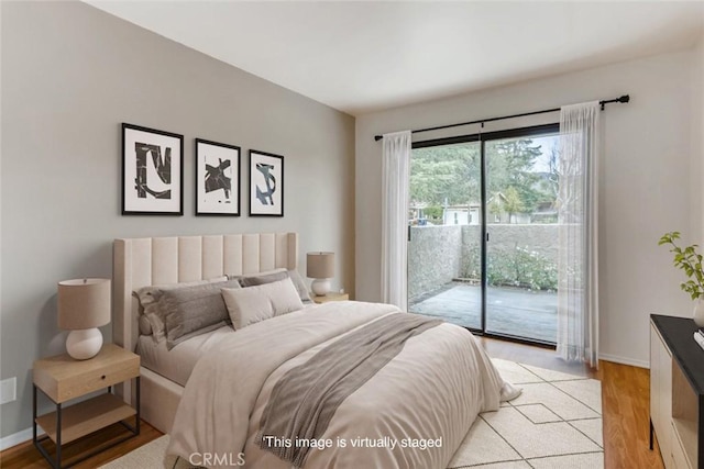 529 El Azul Cir, Oak Park, CA 91377 - bedroom with access to outside and light wood-type flooring
