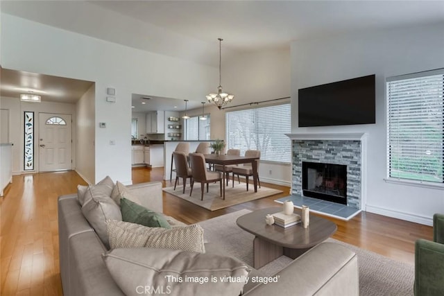 529 El Azul Cir, Oak Park, CA 91377 - living area with a chandelier, wood finished floors, and lofted ceiling