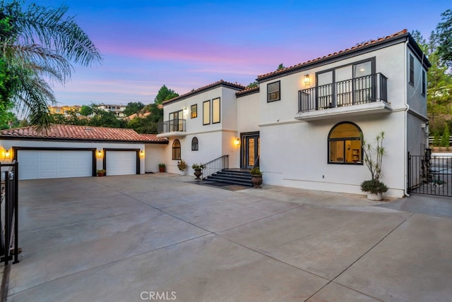 176 Saddlebow Rd, Bell Canyon, CA 91307 - mediterranean / spanish-style house featuring a balcony, a garage, stucco siding, and a tile roof