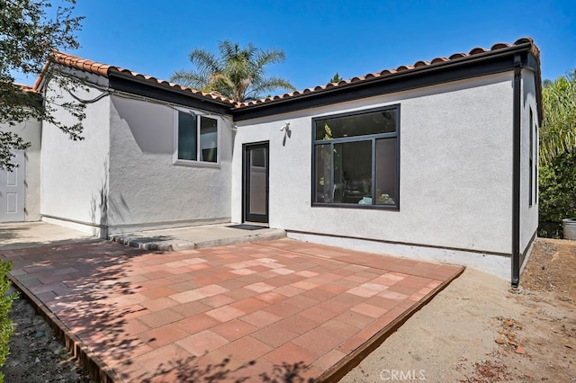 176 Saddlebow Rd, Bell Canyon, CA 91307 - back of house featuring a patio, stucco siding, and a tiled roof