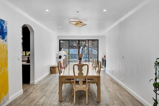 176 Saddlebow Rd, Bell Canyon, CA 91307 - dining area with light wood finished floors, arched walkways, crown molding, and recessed lighting
