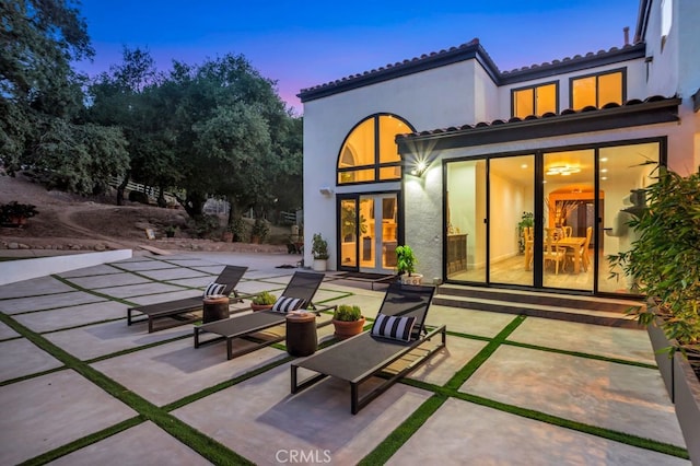 176 Saddlebow Rd, Bell Canyon, CA 91307 - back of property with a patio area, stucco siding, a tiled roof, and french doors