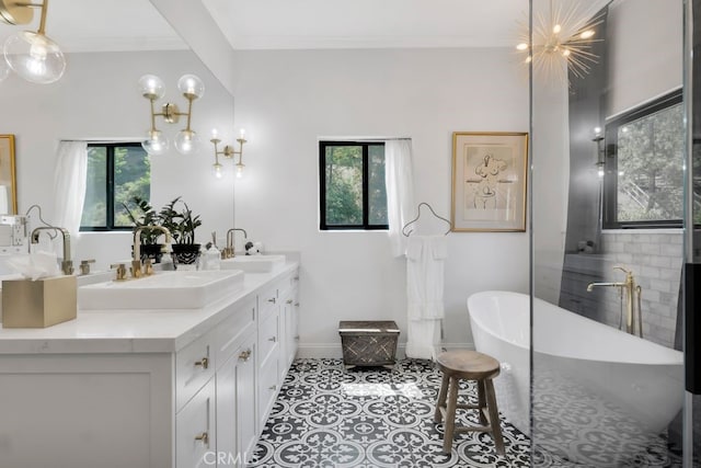 176 Saddlebow Rd, Bell Canyon, CA 91307 - full bathroom featuring double vanity, a soaking tub, healthy amount of natural light, crown molding, and tile patterned floors