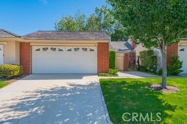 14 Featherwood, Irvine, CA 92612 - ranch-style house with brick siding, concrete driveway, and a garage