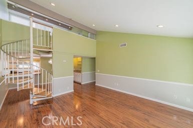 14 Featherwood, Irvine, CA 92612 - unfurnished room featuring wood finished floors, plenty of natural light, and stairs