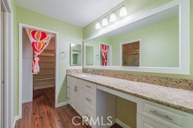 14 Featherwood, Irvine, CA 92612 - bathroom with vanity, wood finished floors, and a spacious closet