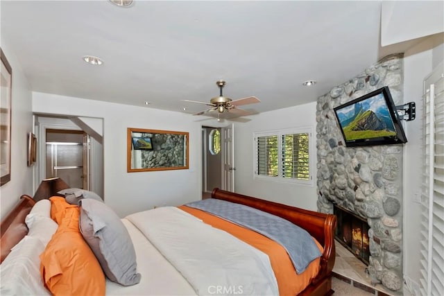 544 Old Toll Rd, Lake Arrowhead, CA 92352 - bedroom with a fireplace and ceiling fan