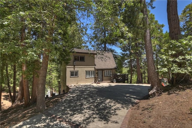 544 Old Toll Rd, Lake Arrowhead, CA 92352 - rustic home with concrete driveway and roof with shingles