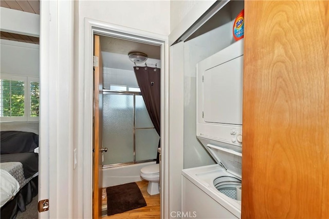 544 Old Toll Rd, Lake Arrowhead, CA 92352 - laundry room with stacked washer / drying machine and wood finished floors