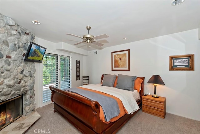 544 Old Toll Rd, Lake Arrowhead, CA 92352 - bedroom featuring carpet floors, access to outside, ceiling fan, a stone fireplace, and recessed lighting