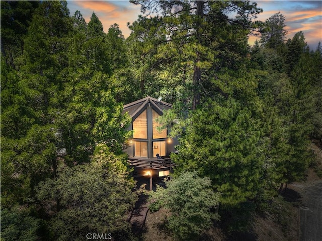 544 Old Toll Rd, Lake Arrowhead, CA 92352 - property exterior at dusk featuring a wooded view