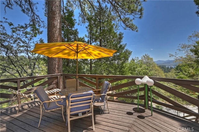 544 Old Toll Rd, Lake Arrowhead, CA 92352 - deck with outdoor dining space and a mountain view