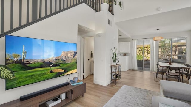 4058 Ivey Vista Way, Oceanside, CA 92057 - living room with light wood-style floors and baseboards