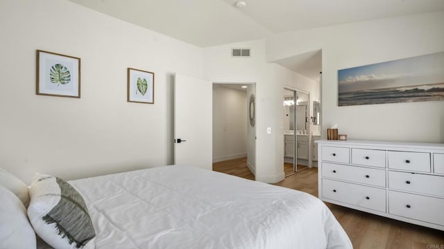4058 Ivey Vista Way, Oceanside, CA 92057 - bedroom featuring wood finished floors and ensuite bath