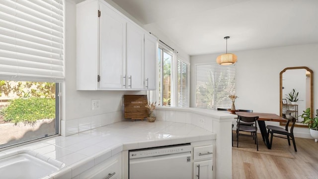 4058 Ivey Vista Way, Oceanside, CA 92057 - kitchen with dishwasher, white cabinetry, tile counters, and light wood-type flooring