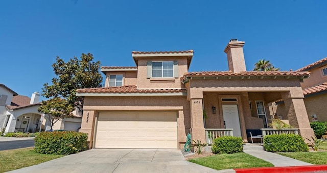 4058 Ivey Vista Way, Oceanside, CA 92057 - mediterranean / spanish-style house featuring driveway, stucco siding, covered porch, a chimney, and an attached garage