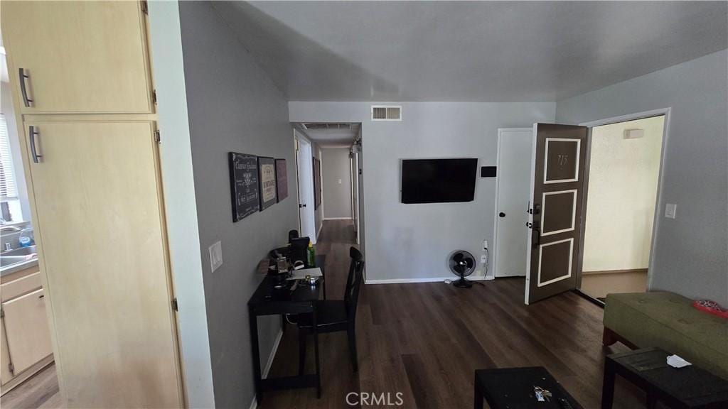 27907 Tyler Ln Unit 715, Canyon Country, CA 91387 - living room with dark wood-style flooring and baseboards