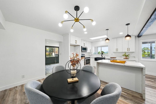 12049 Coping Pl, Lakeside, CA 92040 - dining space with a chandelier and light wood-type flooring