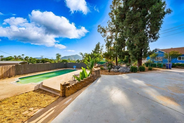 12049 Coping Pl, Lakeside, CA 92040 - view of pool with a patio area, a fenced backyard, and a mountain view