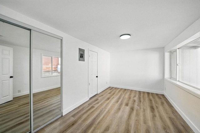 12049 Coping Pl, Lakeside, CA 92040 - unfurnished bedroom with wood finished floors and electric panel