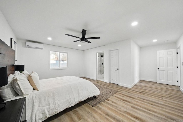 12049 Coping Pl, Lakeside, CA 92040 - bedroom with light wood-style flooring, an AC wall unit, recessed lighting, a ceiling fan, and ensuite bath