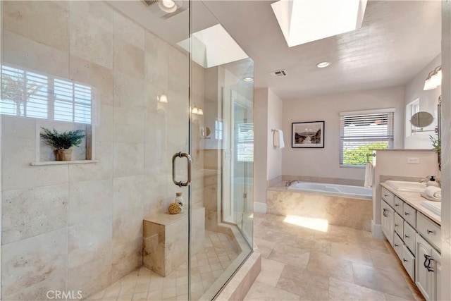 218 Covina Ave, Long Beach, CA 90803 - full bath with a bath, double vanity, a stall shower, and a skylight