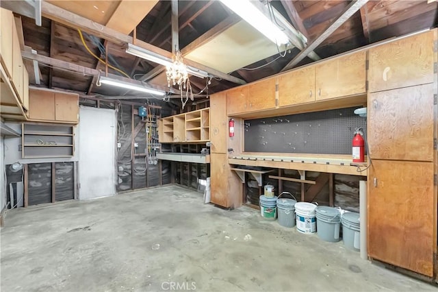 13925 Belgate St, Baldwin Park, CA 91706 - unfinished basement featuring a workshop area