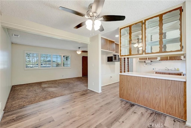 13925 Belgate St, Baldwin Park, CA 91706 - unfurnished room with ceiling fan, light wood finished floors, and a textured ceiling