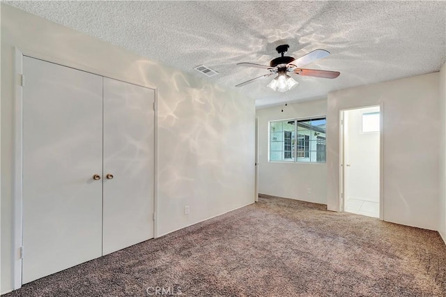 13925 Belgate St, Baldwin Park, CA 91706 - unfurnished bedroom with a textured ceiling, carpet flooring, ceiling fan, and a closet