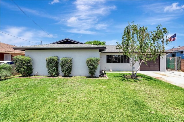 13925 Belgate St, Baldwin Park, CA 91706 - view of front facade with stucco siding, concrete driveway, and an attached garage