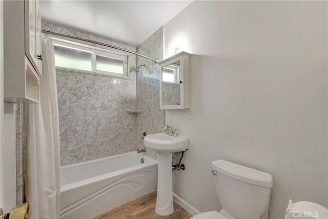 13925 Belgate St, Baldwin Park, CA 91706 - full bathroom with shower / tub combo with curtain and wood finished floors