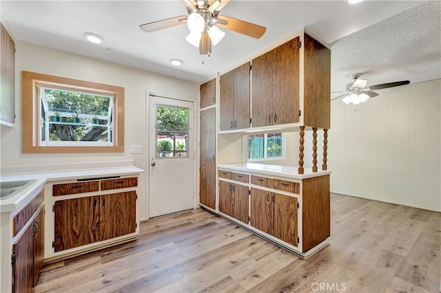 13925 Belgate St, Baldwin Park, CA 91706 - kitchen with ceiling fan, light wood finished floors, light countertops, a peninsula, and recessed lighting