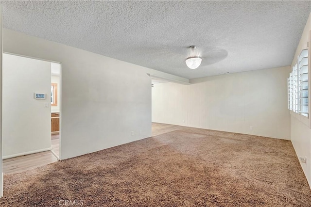 13925 Belgate St, Baldwin Park, CA 91706 - empty room with carpet and a textured ceiling
