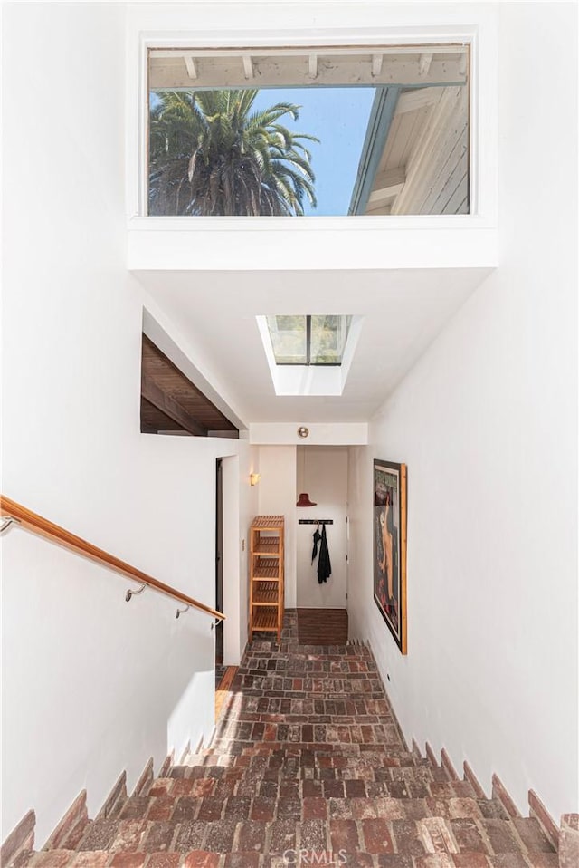 1551 N Beverly Glen Blvd, Los Angeles, CA 90077 - stairs with brick floors and a skylight