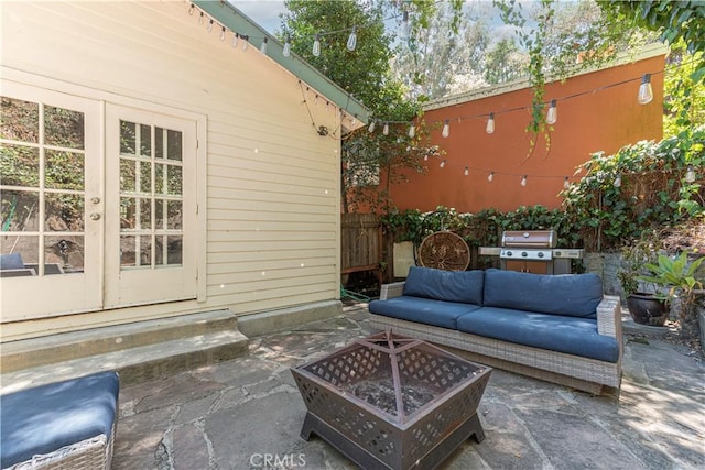 1551 N Beverly Glen Blvd, Los Angeles, CA 90077 - view of patio featuring french doors, an outdoor living space with a fire pit, and a grill