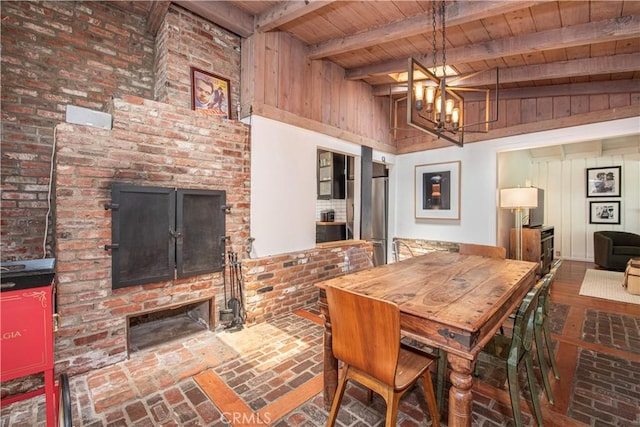 1551 N Beverly Glen Blvd, Los Angeles, CA 90077 - dining area with a wooden ceiling with exposed beams, brick flooring, and a chandelier