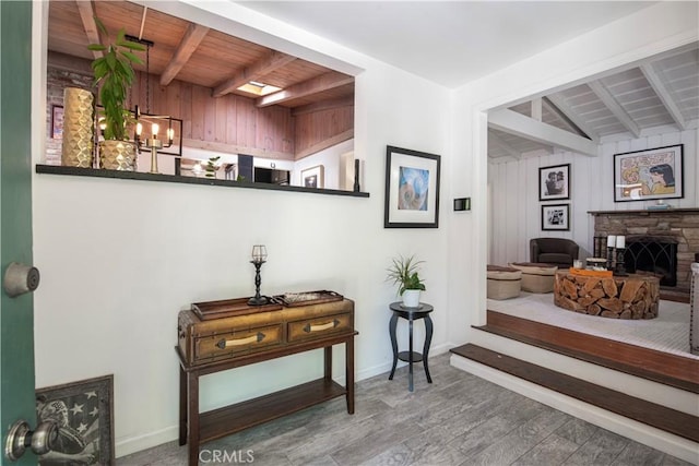 1551 N Beverly Glen Blvd, Los Angeles, CA 90077 - hall with a wood ceiling with exposed beams, wood finished floors, and a chandelier