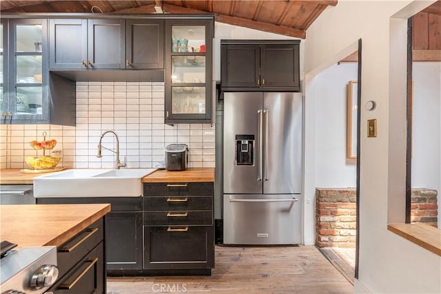 1551 N Beverly Glen Blvd, Los Angeles, CA 90077 - kitchen featuring high quality fridge, butcher block counters, wood ceiling, lofted ceiling, and light wood-style flooring