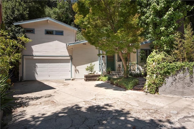 1551 N Beverly Glen Blvd, Los Angeles, CA 90077 - view of front of property featuring driveway and a garage
