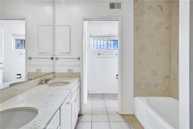 211 Peacock Ln, Montebello, CA 90640 - bathroom featuring tile patterned floors, double vanity, and a tub to relax in