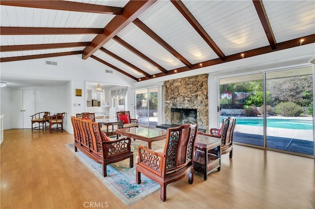 211 Peacock Ln, Montebello, CA 90640 - dining space with light wood-style floors and a stone fireplace