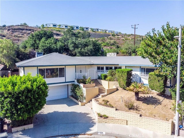 211 Peacock Ln, Montebello, CA 90640 - single story home featuring driveway, stairs, an attached garage, stucco siding, and roof with shingles
